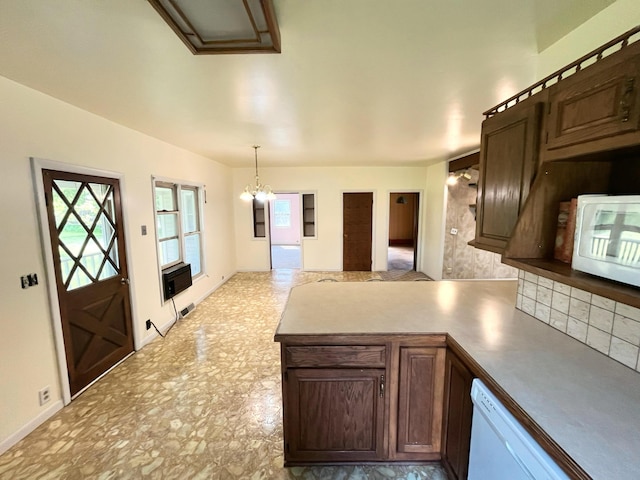 15522 Kimball Rd, Trufant, MI 49347 - kitchen featuring plenty of natural light, white appliances, a peninsula, and a chandelier