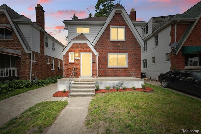 18287 Santa Rosa Dr, Dearborn, MI 48221 - english style home with a front lawn and brick siding