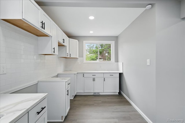18287 Santa Rosa Dr, Dearborn, MI 48221 - kitchen featuring backsplash, wood finished floors, white cabinets, recessed lighting, and baseboards
