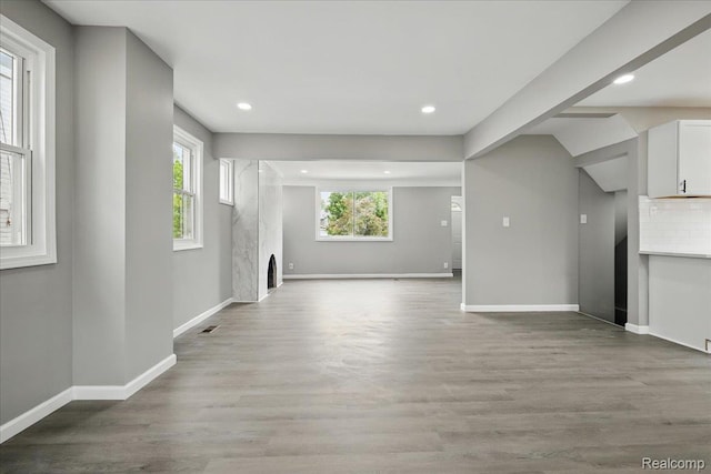 18287 Santa Rosa Dr, Dearborn, MI 48221 - unfurnished living room with a fireplace, baseboards, plenty of natural light, wood finished floors, and recessed lighting