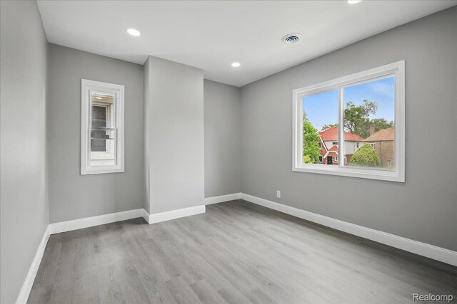 18287 Santa Rosa Dr, Dearborn, MI 48221 - unfurnished room with wood finished floors, baseboards, and recessed lighting