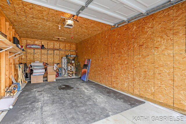 5869 Crosswinds Dr Unit 21, Norton Shores, MI 49444 - garage featuring a garage door opener