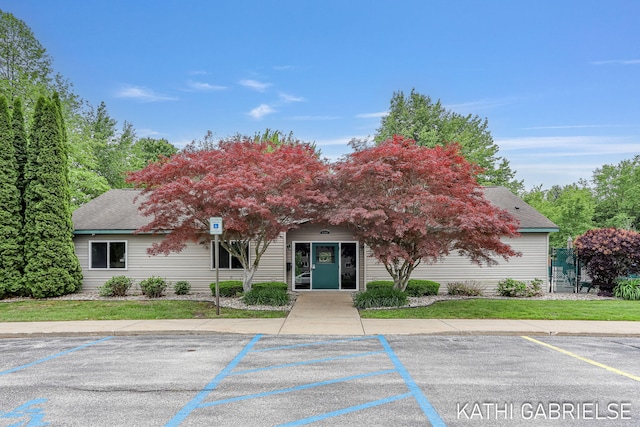 5869 Crosswinds Dr Unit 21, Norton Shores, MI 49444 - view of property featuring uncovered parking