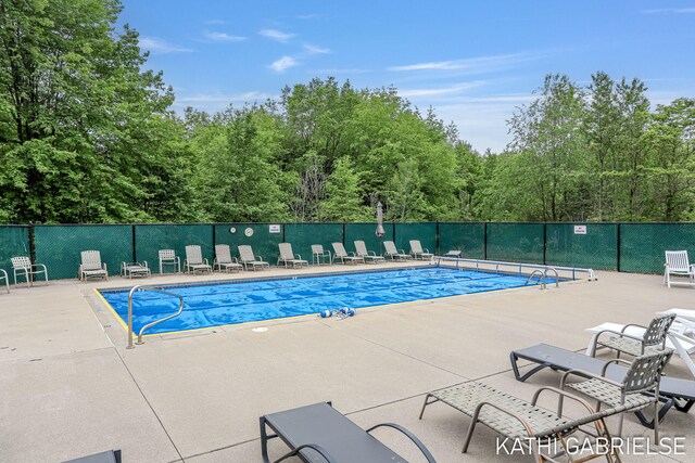 5869 Crosswinds Dr Unit 21, Norton Shores, MI 49444 - community pool with a patio