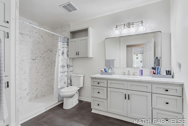 5869 Crosswinds Dr Unit 21, Norton Shores, MI 49444 - full bath with toilet, vanity, a stall shower, and tile patterned floors
