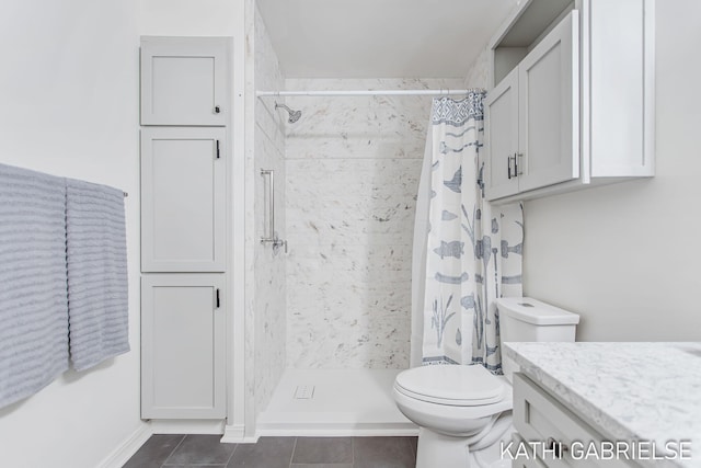 5869 Crosswinds Dr Unit 21, Norton Shores, MI 49444 - bathroom with toilet, a shower stall, tile patterned flooring, and vanity