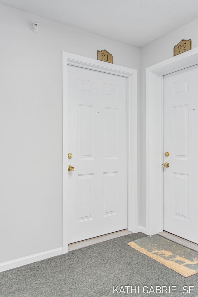 5869 Crosswinds Dr Unit 21, Norton Shores, MI 49444 - view of carpeted entrance foyer