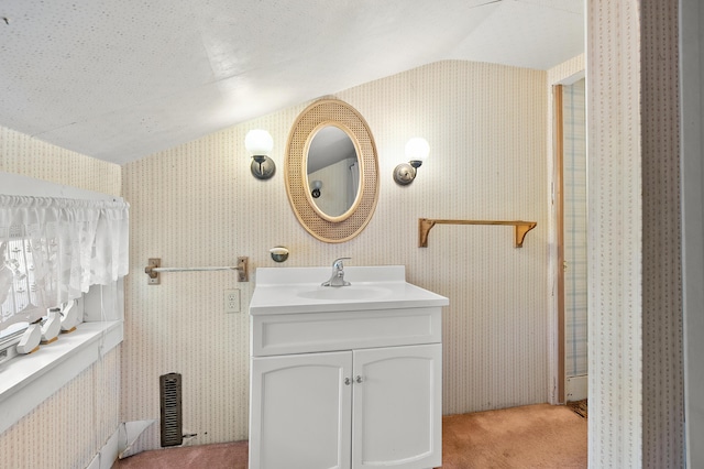 122 N Robinson St, Schoolcraft, MI 49087 - bathroom with vanity, vaulted ceiling, and wallpapered walls