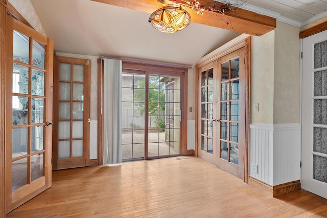 122 N Robinson St, Schoolcraft, MI 49087 - doorway to outside with french doors, wood finished floors, and vaulted ceiling