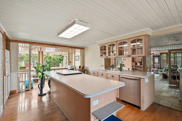 122 N Robinson St, Schoolcraft, MI 49087 - kitchen with dishwasher, a kitchen island, light countertops, glass insert cabinets, and ornamental molding