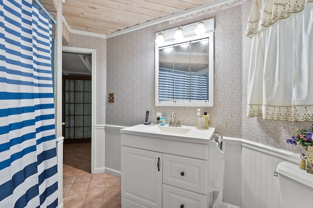 122 N Robinson St, Schoolcraft, MI 49087 - full bathroom featuring wallpapered walls, a wainscoted wall, toilet, vanity, and tile patterned floors