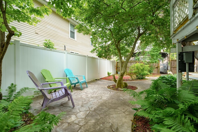 122 N Robinson St, Schoolcraft, MI 49087 - fenced backyard featuring a patio area