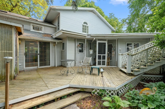 122 N Robinson St, Schoolcraft, MI 49087 - wooden deck featuring a sunroom and stairway