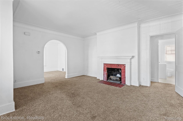4387 Pingree St, Detroit, MI 48204 - unfurnished living room with a brick fireplace, carpet, ornamental molding, arched walkways, and baseboards