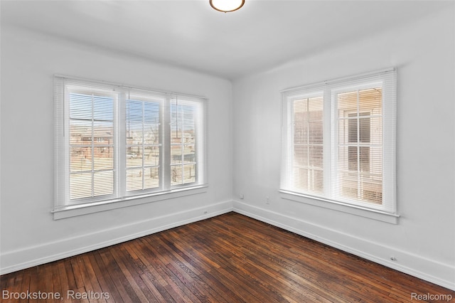 4387 Pingree St, Detroit, MI 48204 - spare room featuring baseboards and dark wood-style floors