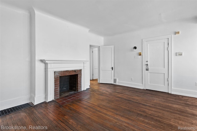 4387 Pingree St, Detroit, MI 48204 - unfurnished living room featuring hardwood / wood-style floors, baseboards, and a brick fireplace