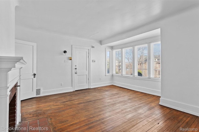 4387 Pingree St, Detroit, MI 48204 - unfurnished living room featuring hardwood / wood-style flooring, baseboards, and a fireplace