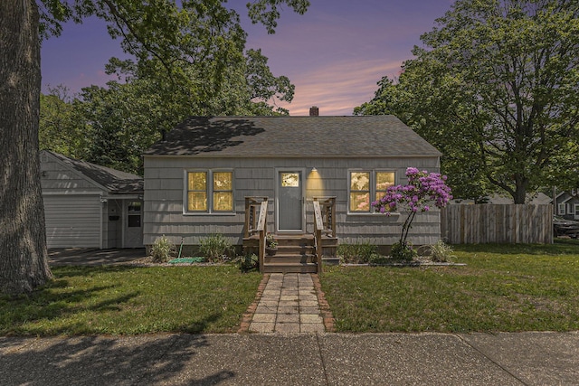 488 Roberts St, Muskegon, MI 49442 - bungalow-style home with roof with shingles and a chimney