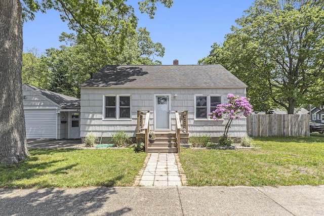 488 Roberts St, Muskegon, MI 49442 - bungalow with a chimney and roof with shingles