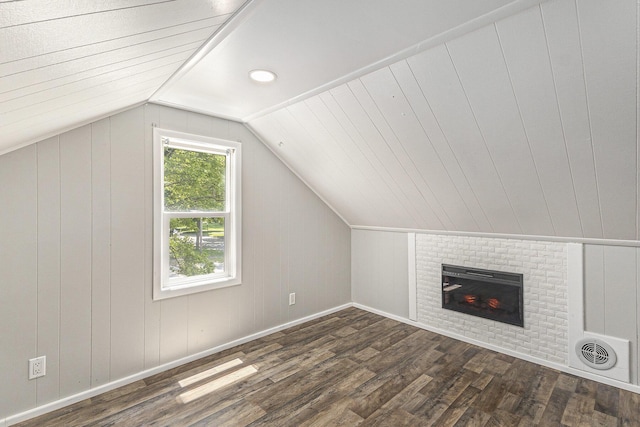 488 Roberts St, Muskegon, MI 49442 - bonus room with dark wood finished floors, lofted ceiling, a brick fireplace, and baseboards