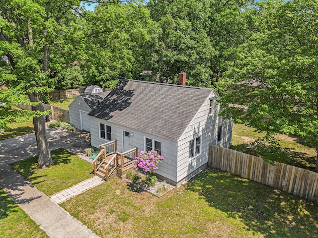 488 Roberts St, Muskegon, MI 49442 - view of front of house with roof with shingles and a chimney