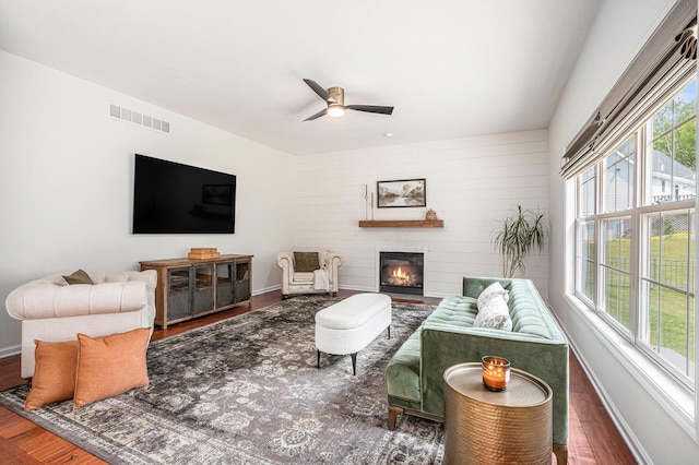 4844 Ontario Dr, Buchanan, MI 49107 - living room with a glass covered fireplace, wood finished floors, and ceiling fan