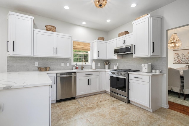 4844 Ontario Dr, Buchanan, MI 49107 - kitchen featuring stainless steel appliances, tasteful backsplash, white cabinets, and recessed lighting
