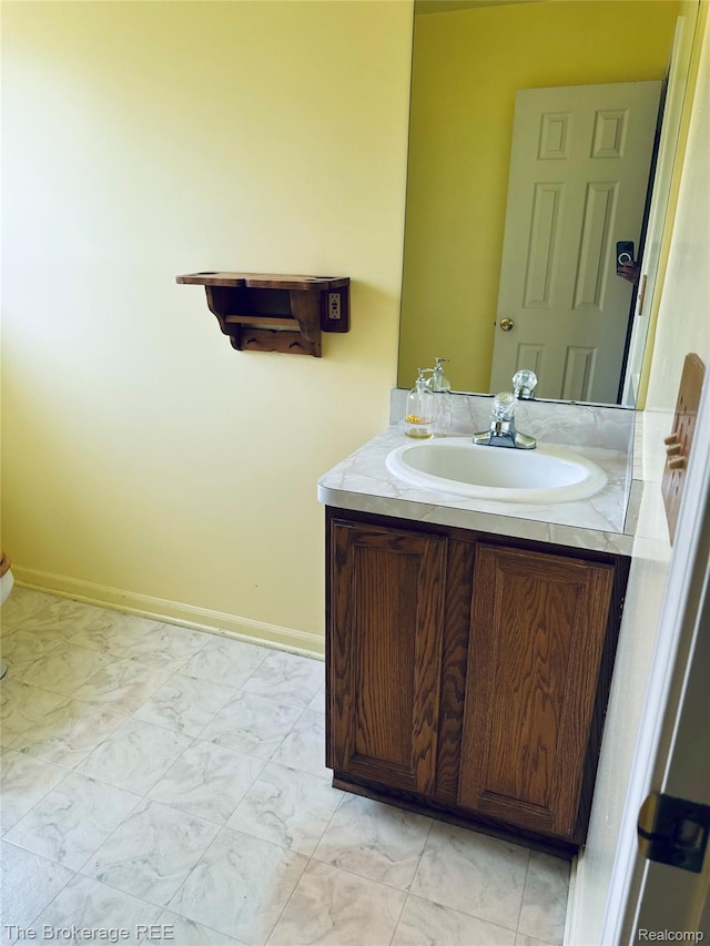 2525 Torrey Grove Ct, Fenton, MI 48430 - bathroom with vanity, marble look tile flooring, and baseboards