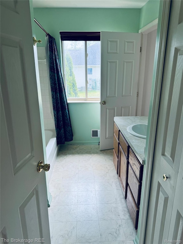 2525 Torrey Grove Ct, Fenton, MI 48430 - bathroom with vanity, marble finish floors, and shower / tub combo with curtain