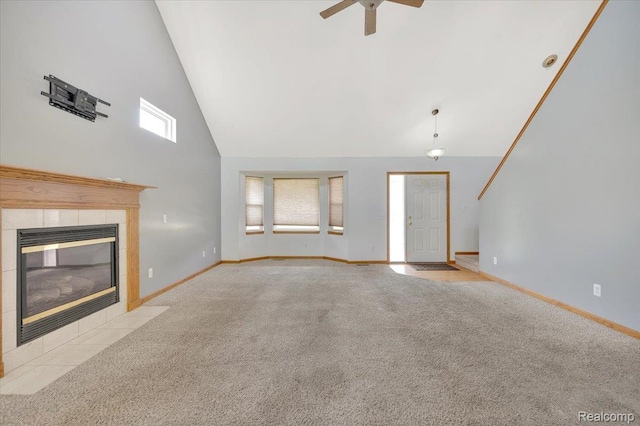 38 Melvin J Ct, Oxford, MI 48371 - unfurnished living room with high vaulted ceiling, carpet flooring, a tile fireplace, ceiling fan, and baseboards