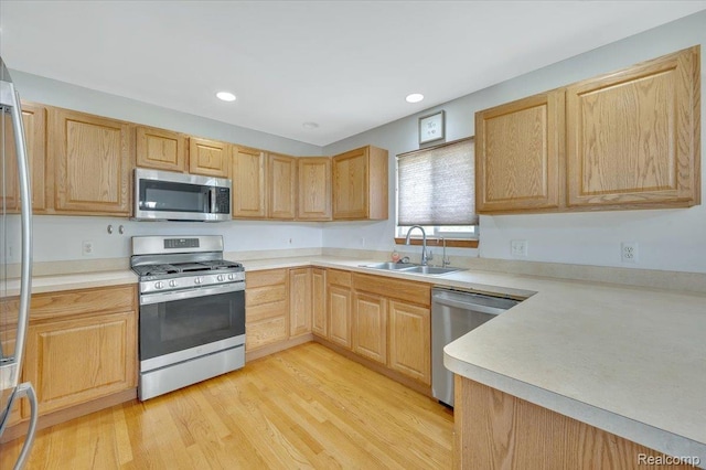 38 Melvin J Ct, Oxford, MI 48371 - kitchen featuring appliances with stainless steel finishes, a sink, light brown cabinets, light countertops, and recessed lighting