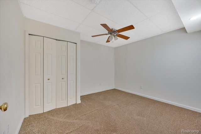 38 Melvin J Ct, Oxford, MI 48371 - unfurnished bedroom with carpet floors, a closet, baseboards, a drop ceiling, and a ceiling fan