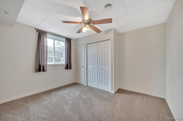 38 Melvin J Ct, Oxford, MI 48371 - unfurnished bedroom featuring carpet floors, a closet, ceiling fan, baseboards, and a paneled ceiling