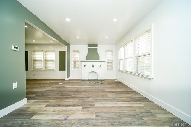 16240 Washburn St, Detroit, MI 48221 - unfurnished living room with recessed lighting, plenty of natural light, baseboards, and wood finished floors