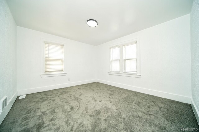 16240 Washburn St, Detroit, MI 48221 - unfurnished room featuring carpet flooring, healthy amount of natural light, and baseboards