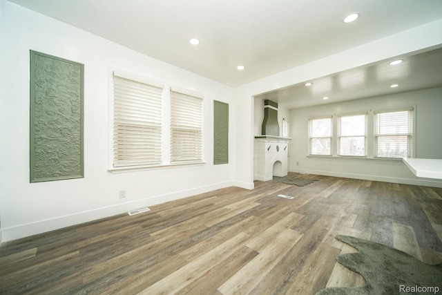 16240 Washburn St, Detroit, MI 48221 - unfurnished living room featuring recessed lighting, baseboards, wood finished floors, and a fireplace