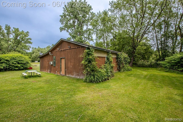 5180 Hillsboro Rd, Davisburg, MI 48350 - view of side of property with a lawn, an outdoor structure, and an outbuilding