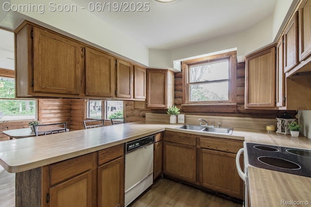 5180 Hillsboro Rd, Davisburg, MI 48350 - kitchen featuring white appliances, rustic walls, a peninsula, light wood finished floors, and brown cabinets