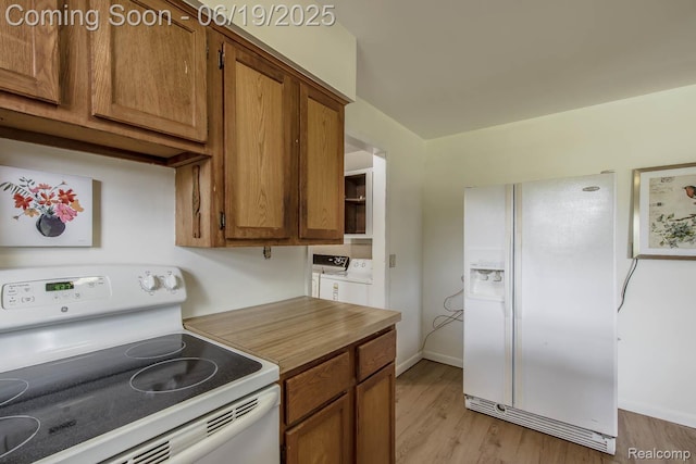 5180 Hillsboro Rd, Davisburg, MI 48350 - kitchen with white appliances, brown cabinets, and light wood-style flooring