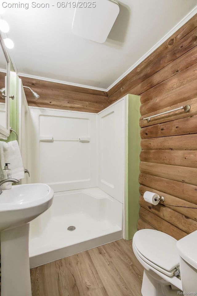 5180 Hillsboro Rd, Davisburg, MI 48350 - full bathroom with rustic walls, a stall shower, and wood finished floors