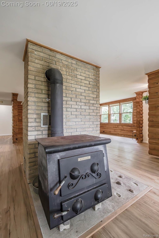 5180 Hillsboro Rd, Davisburg, MI 48350 - detailed view of wood finished floors and a wood stove