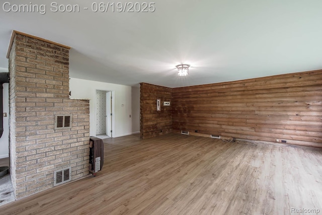 5180 Hillsboro Rd, Davisburg, MI 48350 - unfurnished living room featuring wood finished floors and heating unit