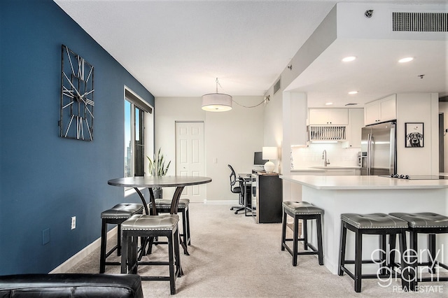 60 Campau Cir NW Unit 2308, Grand Rapids, MI 49503 - dining space with light colored carpet, baseboards, and recessed lighting