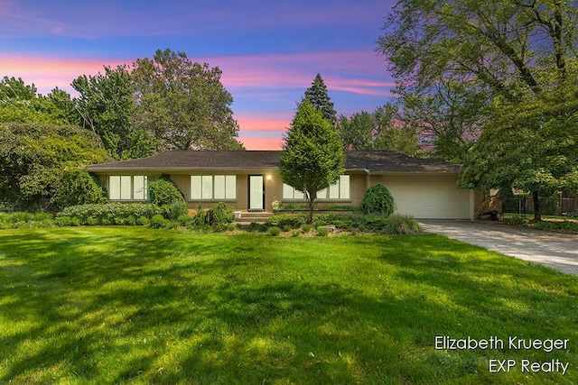 2335 Delange Dr SE, Grand Rapids, MI 49506 - view of front facade with a garage and concrete driveway