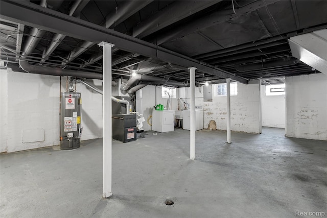 13572 Indiana St, Detroit, MI 48238 - below grade area featuring gas water heater, heating unit, washer and dryer, and electric panel