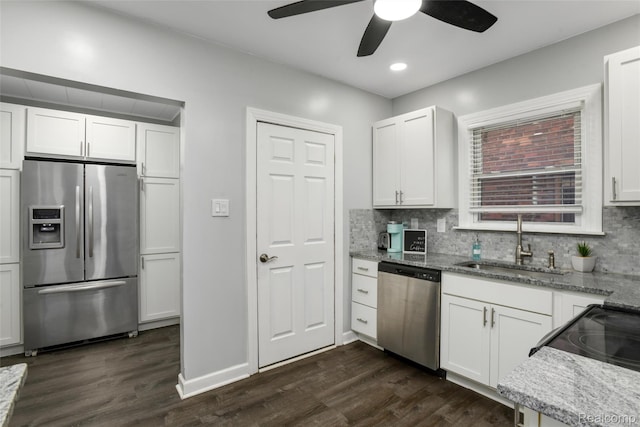 13572 Indiana St, Detroit, MI 48238 - kitchen with stainless steel appliances, a sink, dark wood-style flooring, ceiling fan, and decorative backsplash