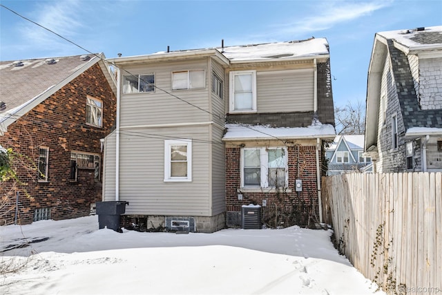 13572 Indiana St, Detroit, MI 48238 - snow covered rear of property with cooling unit and brick siding