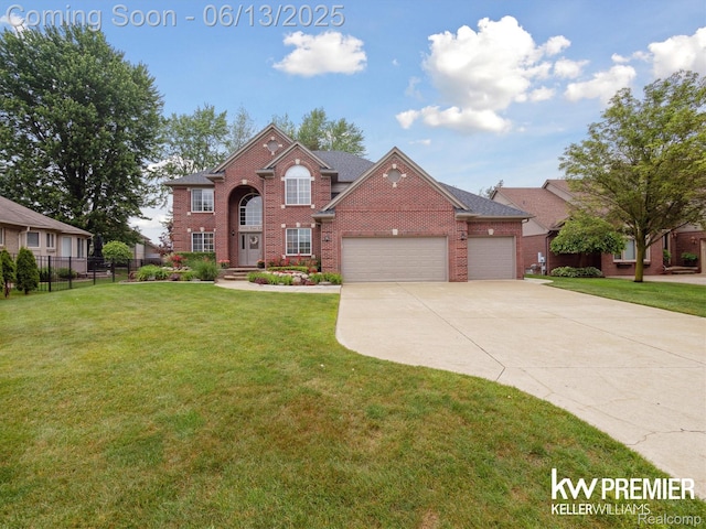 18961 Pine Ln, Macomb, MI 48042 - view of front facade with brick siding, a garage, and concrete driveway