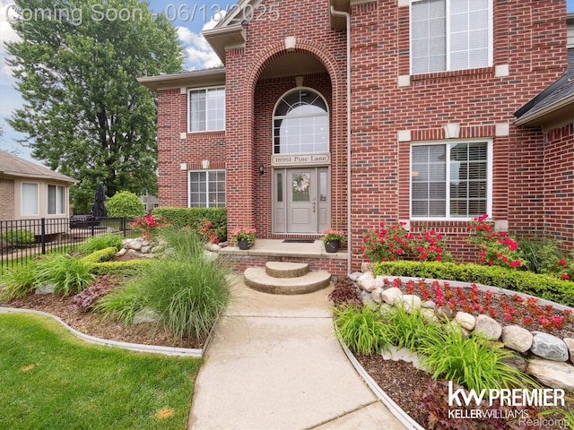 18961 Pine Ln, Macomb, MI 48042 - view of exterior entry with brick siding