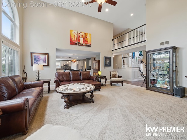 18961 Pine Ln, Macomb, MI 48042 - carpeted living room with a high ceiling, a ceiling fan, stairs, and recessed lighting
